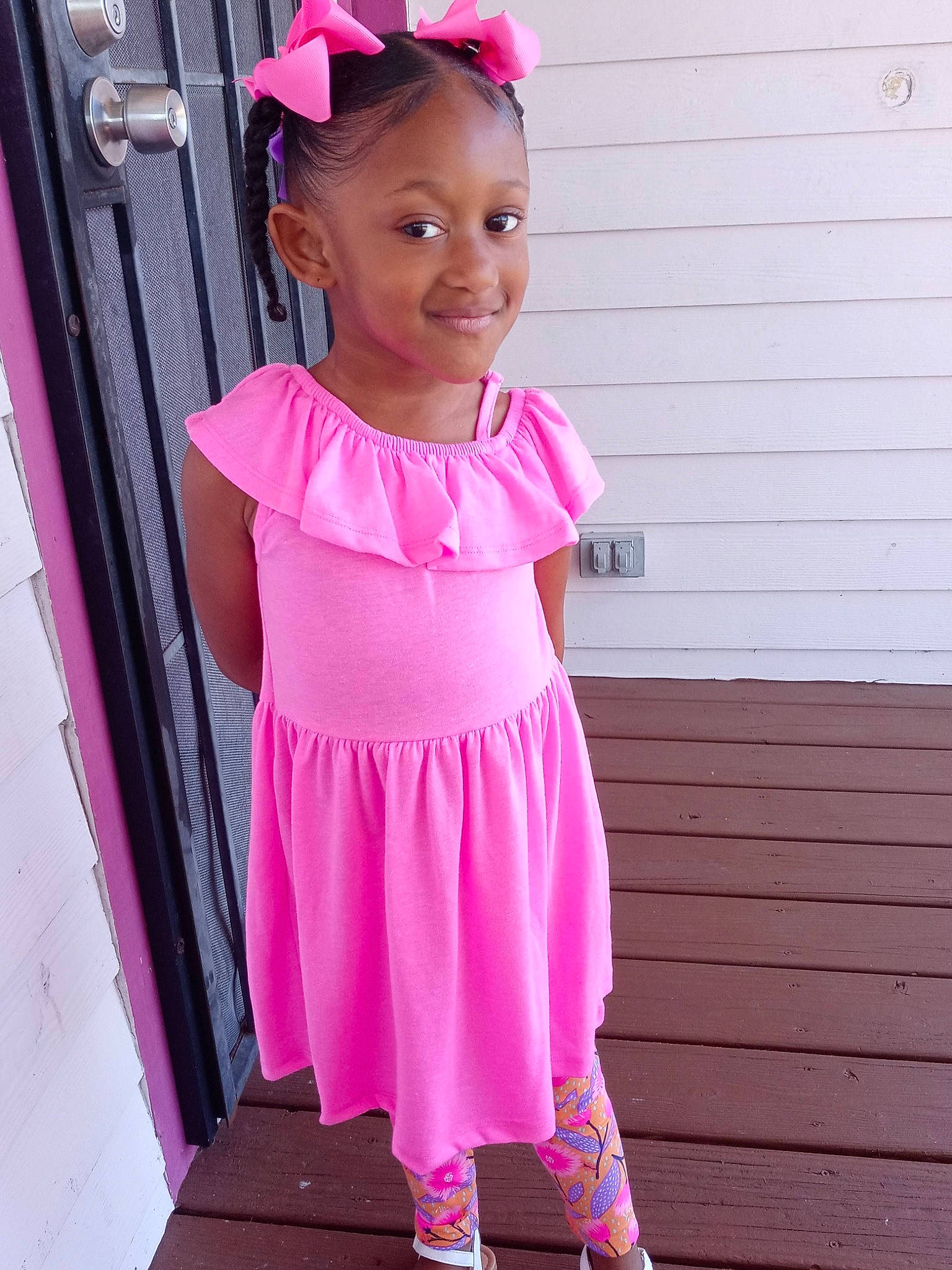 Legacie is registered to the contest to win money with this photo: baby_toddler_clothing, child, clothing, day_dress, door, dress, embellishment, fashion_accessory, happy, joy, magenta, pattern, person, pink, purple, sleeve, smile, street_fashion, toddler, violet