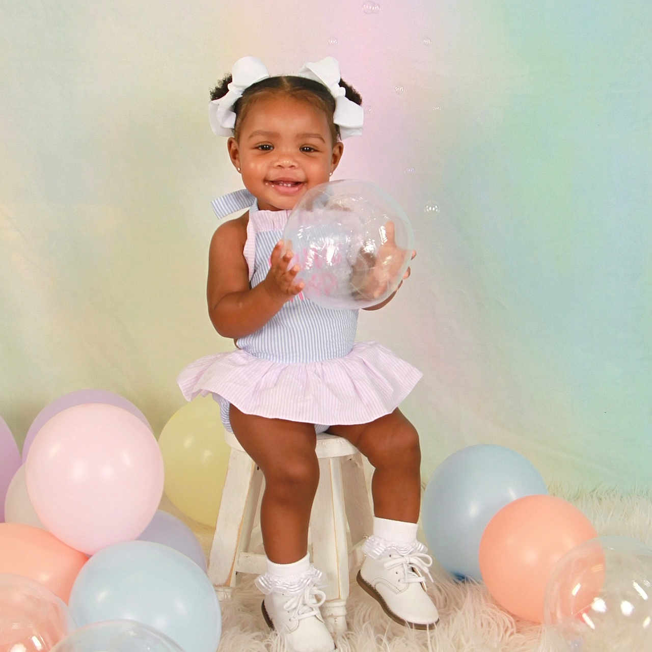 Gianni joined the competition — help win amazing prizes! baby, balloon, bodypart, clothing, dress, face, finger, footwear, hand, happy, hat, head, person, photography, portrait, shoe, sitting, skirt, smile, sphere