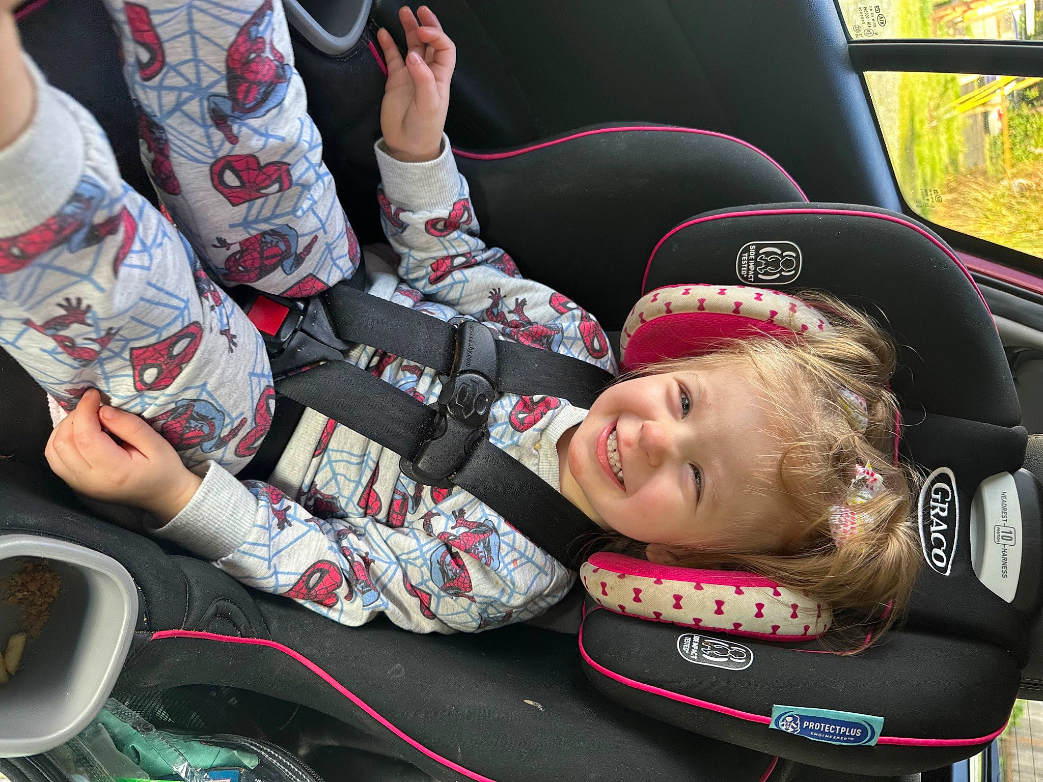 Everly is registered to the contest to win money with this photo: auto_part, automotive_design, automotive_exterior, automotive_tire, automotive_wheel_system, car_seat, car_seat_cover, child, family_car, fun, human_leg, joy, leisure, luxury_vehicle, motor_vehicle, person, personal_protective_equipment, smile, steering_wheel, tire