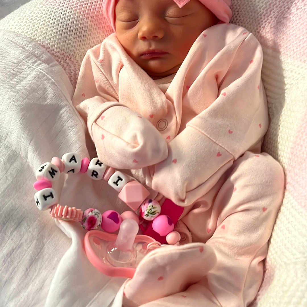 Imari is registered to the contest to win money with this photo: architecture, baby, bed, blanket, building, clothing, cushion, face, furniture, glove, hat, head, homedecor, hospital, newborn, person, photography, portrait, purple, sleeping