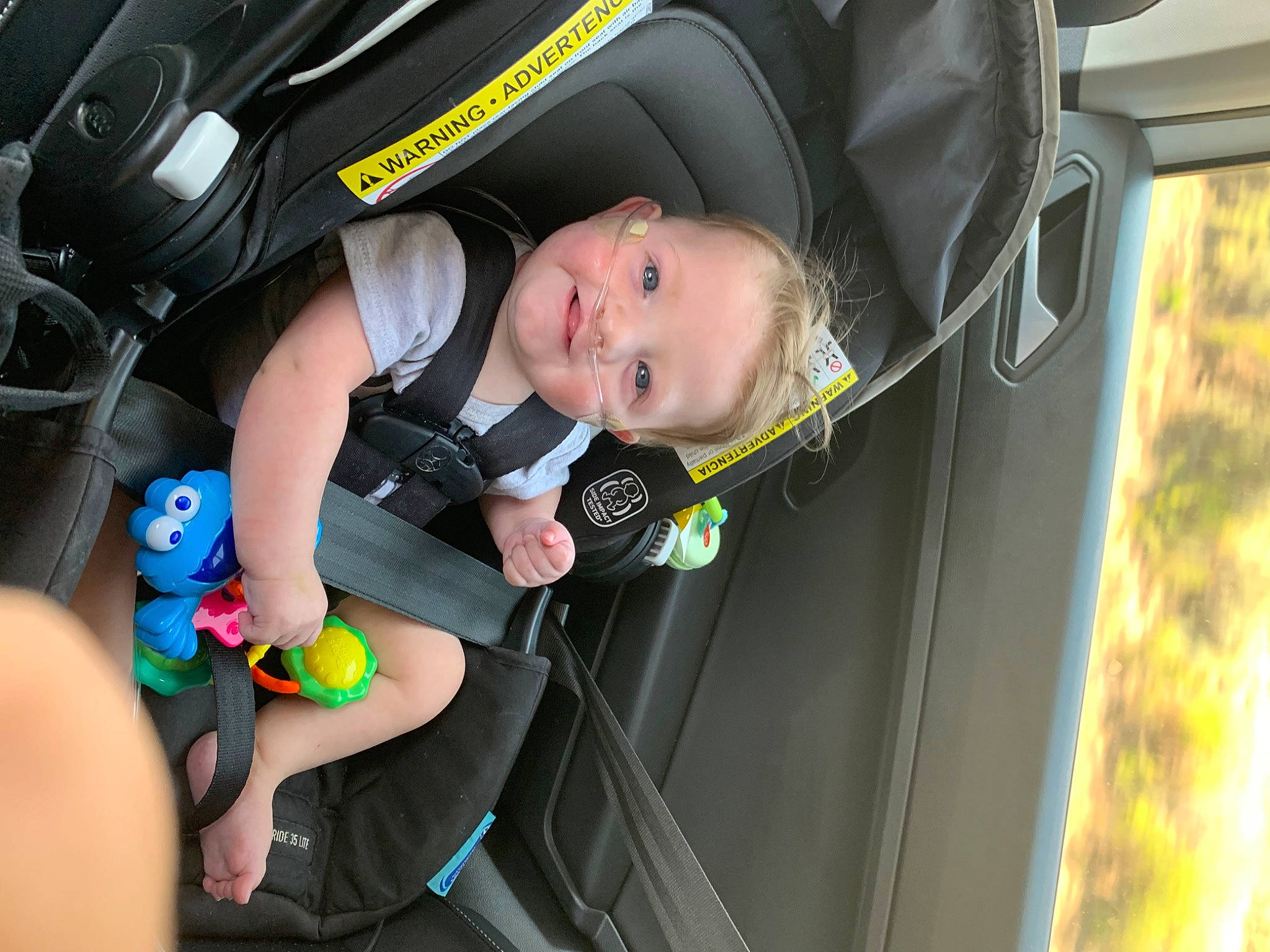 Donovan is registered to the contest to win money with this photo: auto_part, automotive_design, automotive_exterior, baby, baby_carriage, baby_products, car, car_seat, child, comfort, family_car, fun, mode_of_transport, motor_vehicle, person, smile, tire, toddler, vehicle, vehicle_door