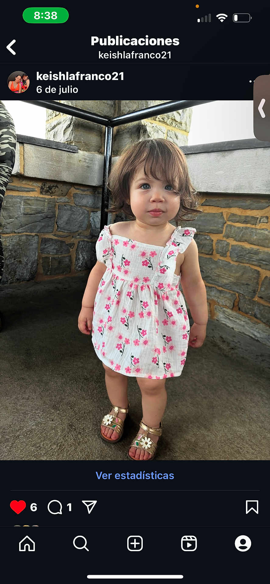 Alaia is registered to the contest to win money with this photo: toddler, child, girl, floral_dress, sandals, stone_wall, concrete_floor, standing, outdoor, curly_hair, cute, portrait, person, casual_clothing, summer, innocent, young, fashion, footwear, expression