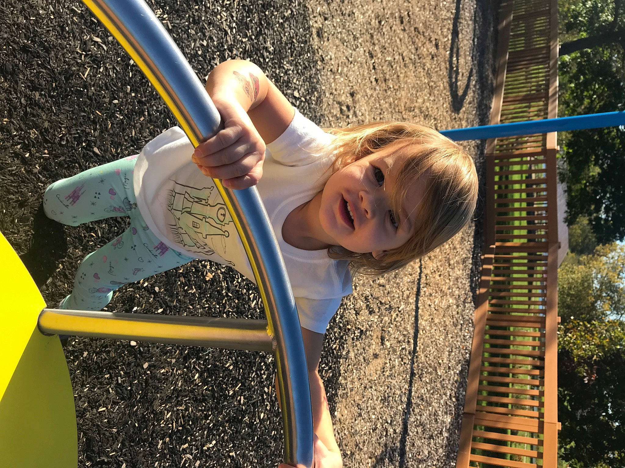 Mya is registered to the contest to win money with this photo: boats_and_boating_equipment_and_supplies, city, daytime, fun, hair, happy, human_body, human_settlement, leisure, outdoor_play_equipment, people_in_nature, person, public_space, recreation, smile, standing, t_shirt, toddler, tree, woody_plant