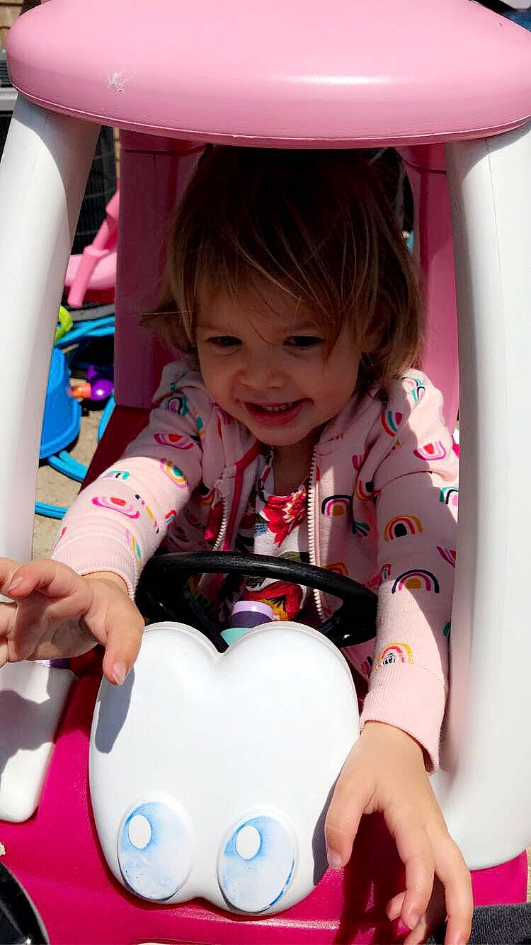 Mya is registered to the contest to win money with this photo: baby_playing_with_toys, baby_toddler_clothing, child, facial_expression, fun, happy, joy, leisure, light, mammal, organ, person, photograph, pink, product, recreation, red, skin, sleeve, smile