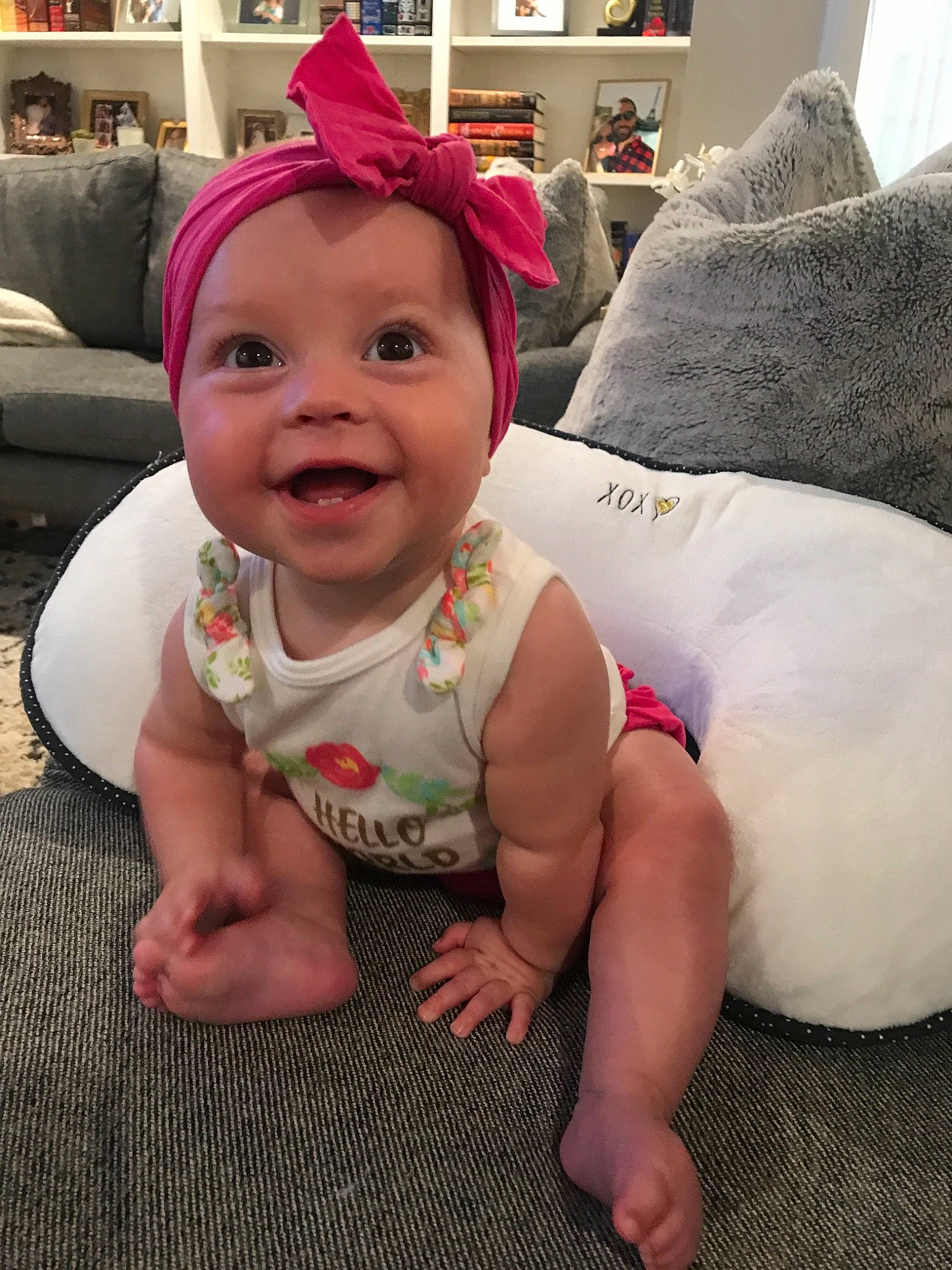 Betty joined the competition — help win amazing prizes! baby, cheek, child, electronic_device, eye, face, facial_expression, floor, flooring, head, headgear, leg, person, pink, play, room, sitting, skin, smile, toddler