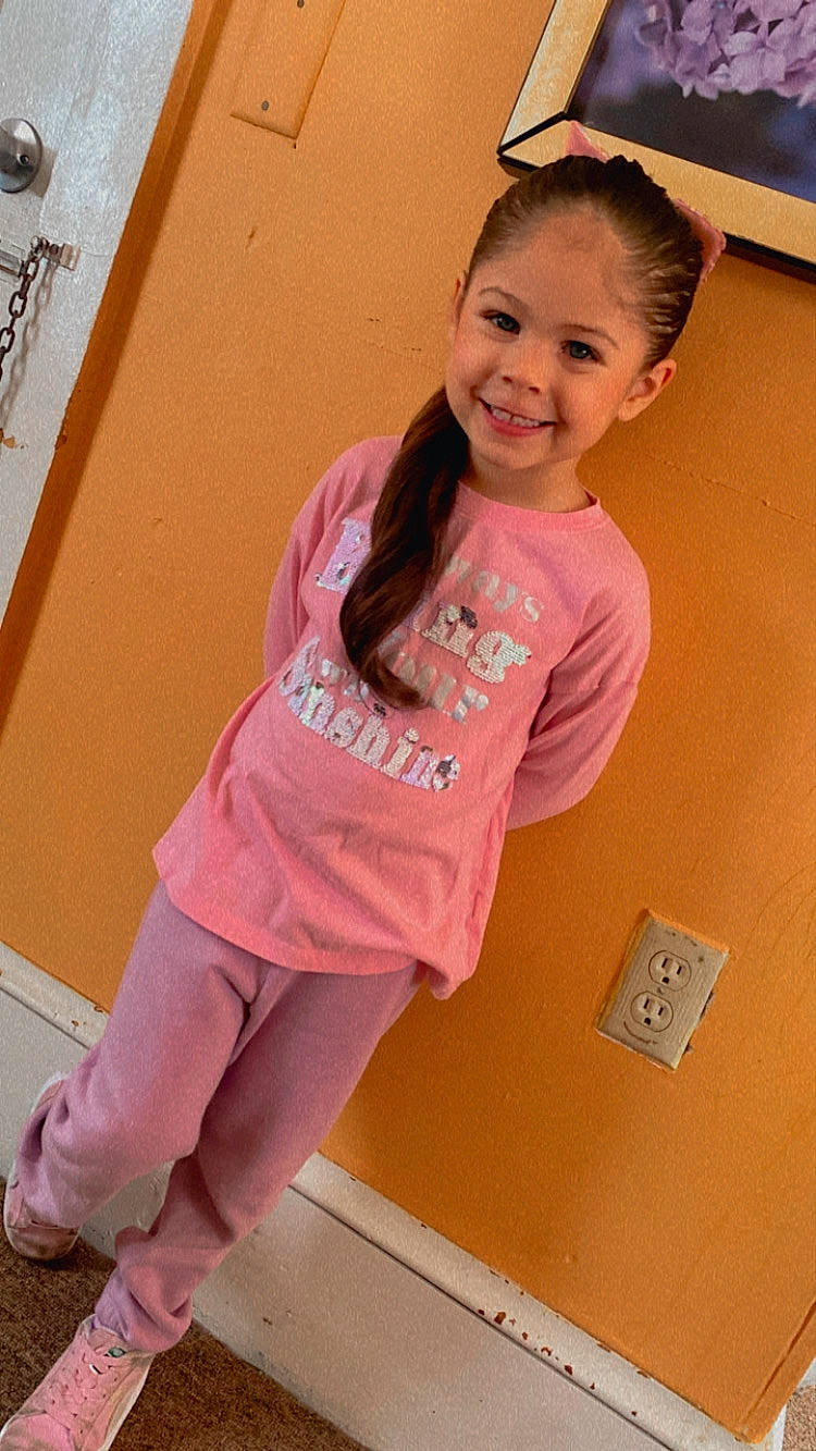 Skyla joined the competition — help win amazing prizes! baby_toddler_clothing, child, fashion_design, hair, happy, human_leg, joy, knee, leg, long_hair, magenta, neck, person, pink, skin, sleeve, smile, standing, t_shirt, thigh