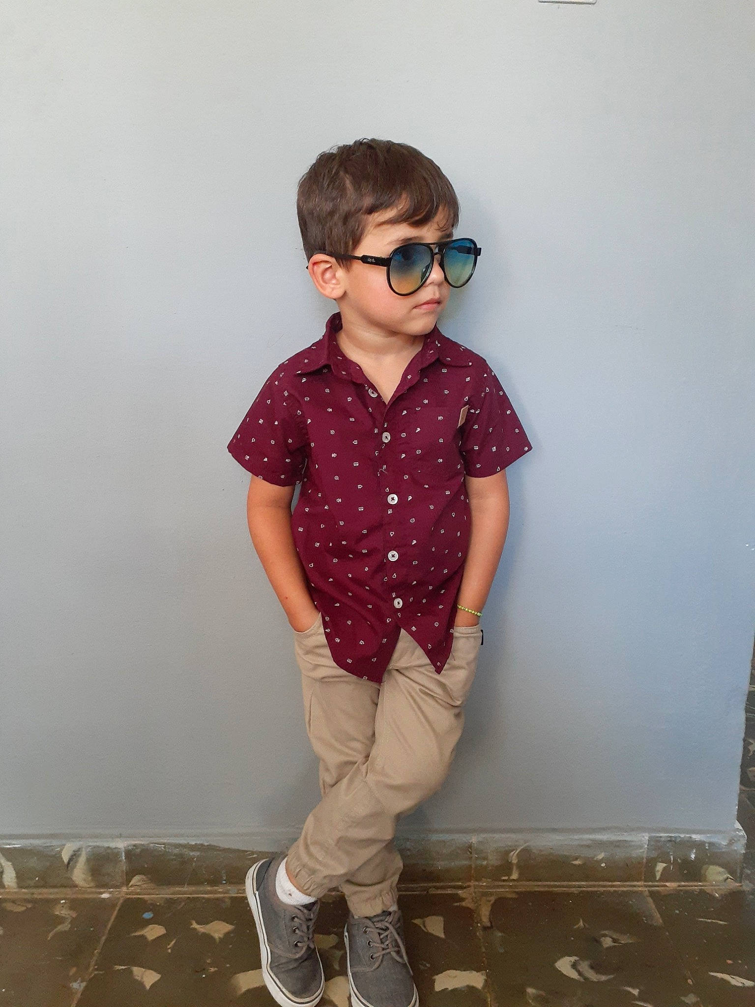 Matthew is registered to the contest to win money with this photo: child, clothing, cool, design, eyewear, footwear, glasses, jeans, neck, outerwear, pattern, person, pink, shoe, shoulder, sleeve, standing, t_shirt, trousers, waist