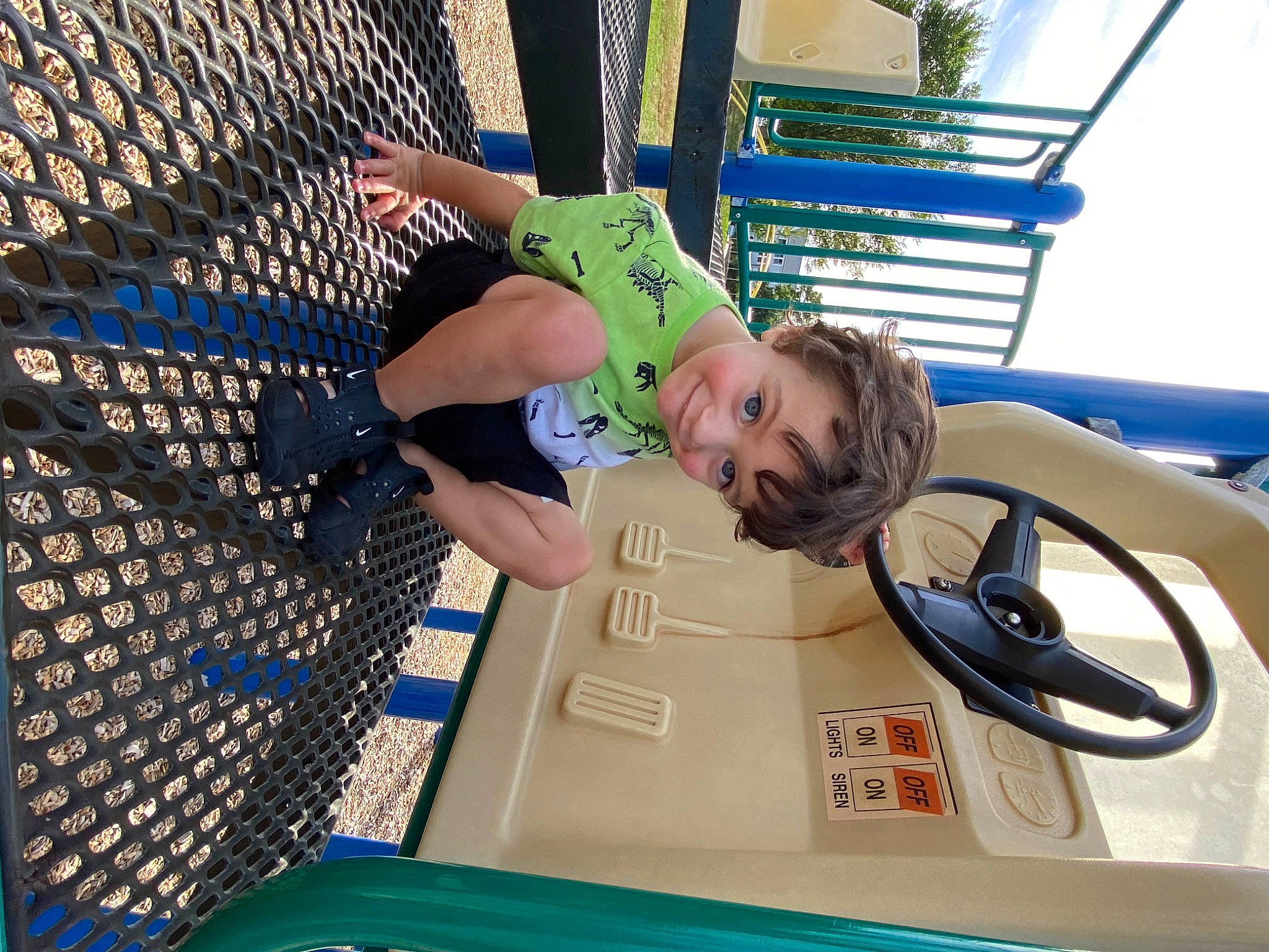 Stellan is registered to the contest to win money with this photo: automotive_exterior, child, electric_blue, fun, happy, joy, leisure, machine, mesh, motor_vehicle, net, pattern, person, recreation, smile, t_shirt, thigh