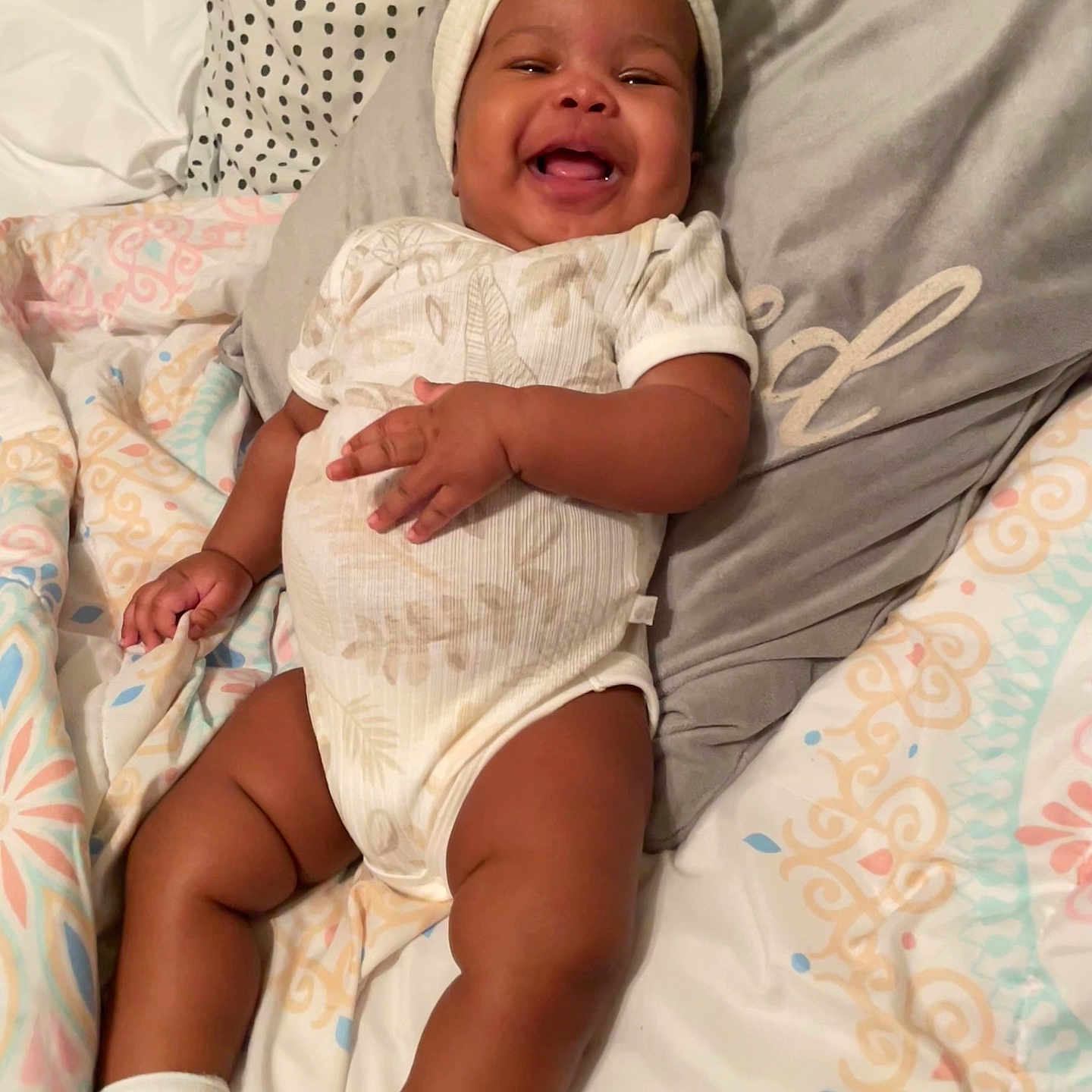Alayah joined the competition — help win amazing prizes! architecture, baby, babylaughing, bed, bedroom, cushion, face, furniture, happy, head, homedecor, indoors, laughing, newborn, person, photography, portrait, quilt, room, smile