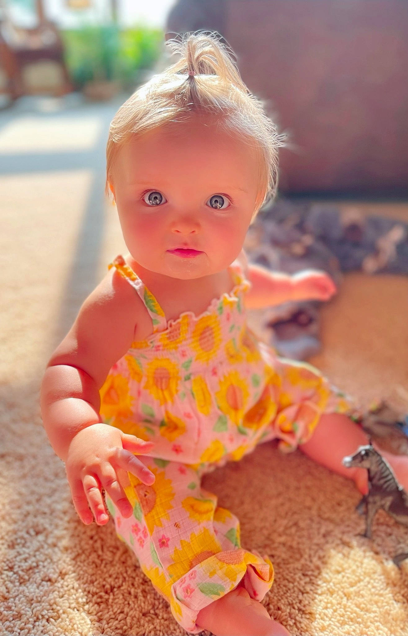 Mylah is registered to the contest to win money with this photo: baby_toddler_clothing, baby_toys, cheek, child, doll, dress, flooring, fun, hair, happy, head, pattern, peach, person, pink, play, sitting, sleeve, toddler, toy