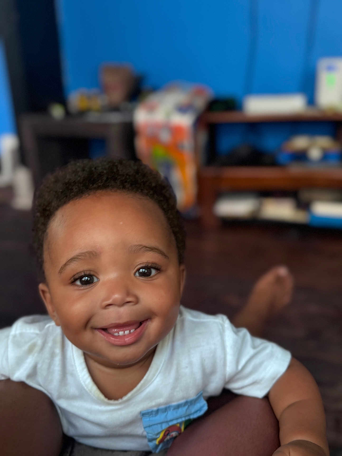 Malano joined the competition — help win amazing prizes! child, toddler, smiling, happy, face, portrait, indoor, casual_clothing, curly_hair, cute, young_child, baby, person, skin, eyes, mouth, sitting, playful, expression, home