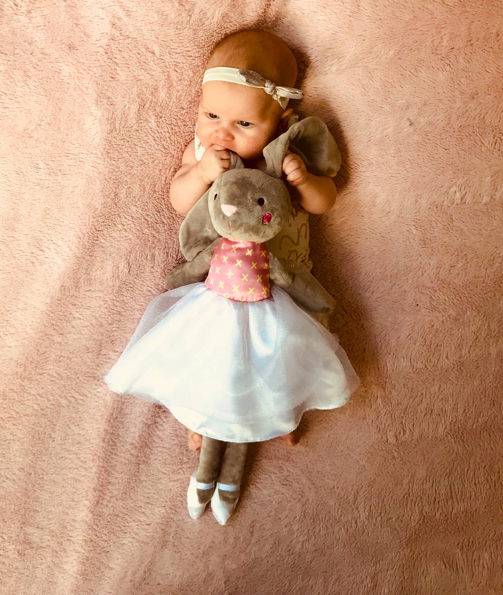 Harper is registered to the contest to win money with this photo: beige, brown_hair, cheek, child, doll, dress, figurine, footwear, joint, person, pink, shoe, skin, toy