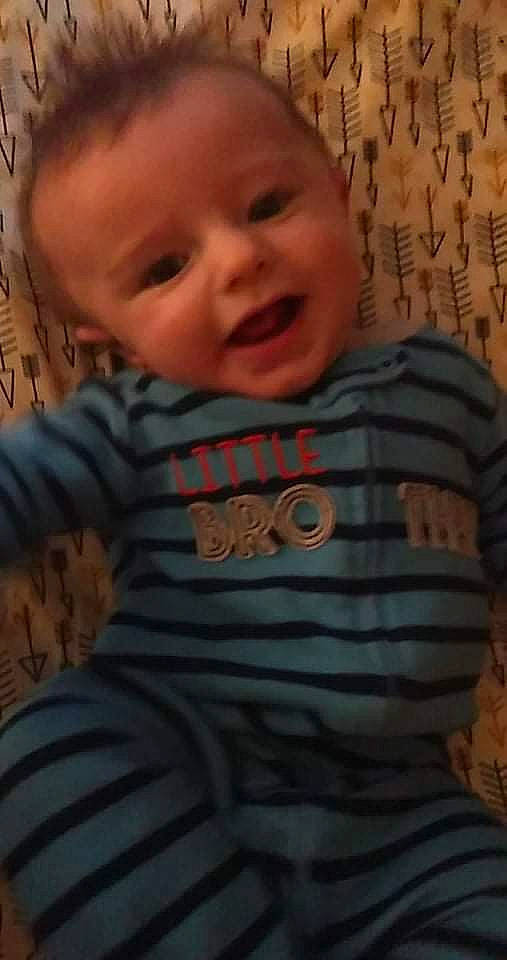 Israel is registered to the contest to win money with this photo: baby, baby_toddler_clothing, cheek, child, chin, comfort, eyebrow, face, facial_expression, finger, forehead, happy, iris, mouth, nose, organ, person, skin, sleeve, smile