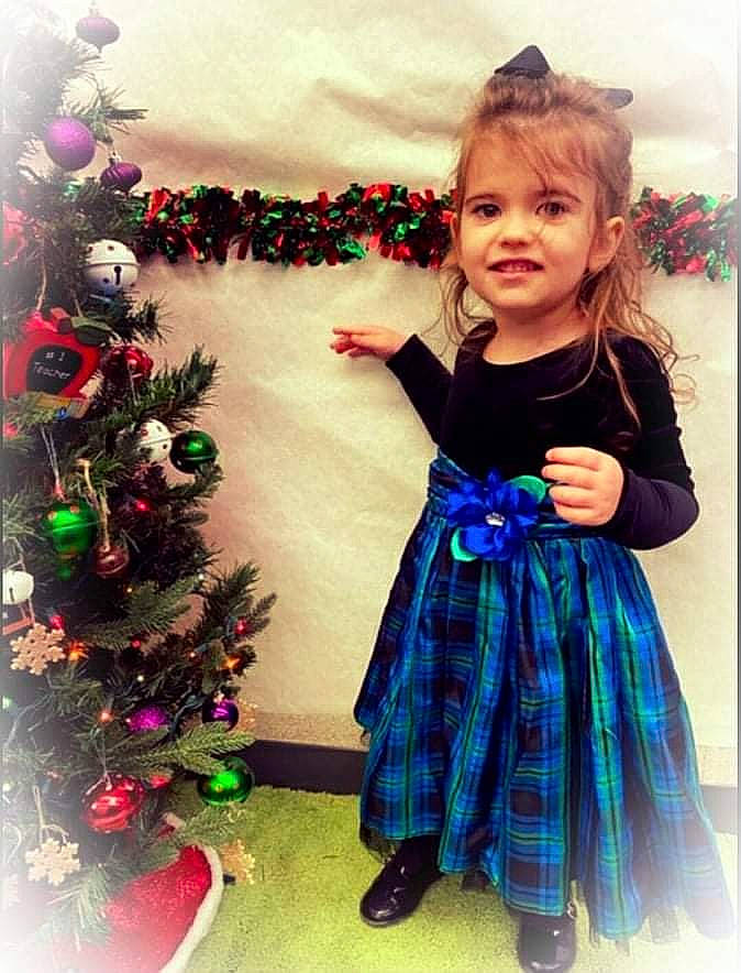 Eden joined the competition — help win amazing prizes! baby_toddler_clothing, christmas_ornament, christmas_tree, dress, facial_expression, fashion, green, hair, hairstyle, happy, head, holiday_ornament, human_body, joy, one_piece_garment, outerwear, person, pink, plant, sleeve