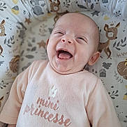 Ella a rejoint le concours — aidez-le/la à gagner de superbes lots ! baby, infant, smiling, laughing, pink_clothing, soft_fabric, cushion, animal_print, woodland_theme, deer, rabbit, leaf_pattern, cute, happy, child, portrait, indoors, cozy, expression, face