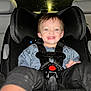 toddler, child, car_seat, smiling, happy, seatbelt, drool, indoor, car_interior, night, window, rain, clothing, casual, baby, young_child, face, person, safety, seat