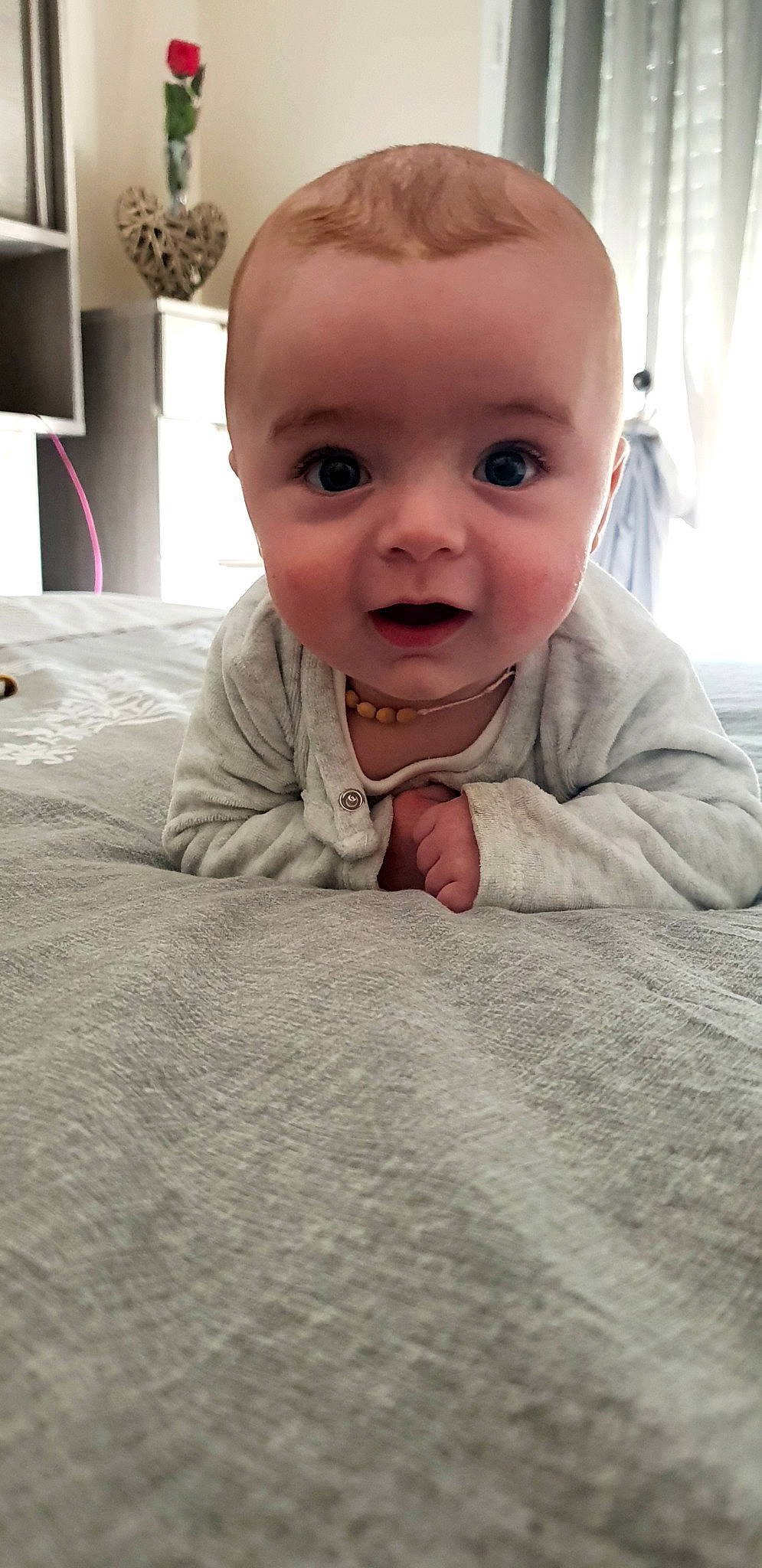 Nohlan participe au concours pour gagner de l'argent avec cette photo : baby, baby_toddler_clothing, cheek, comfort, crawling, curtain, eyebrow, floor, flooring, fun, gesture, happy, iris, linens, mouth, nose, person, skin, sleeve, toddler