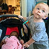 Legend joined the competition — help win amazing prizes! toddler, baby, infant, car_seat, blanket, toy, indoor, child, person, curious, blue_eyes, holding, clothing, home, furniture, table, chair, floor, leg, footwear