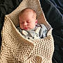 newborn, baby, sleeping, blanket, knitted, cozy, infant, cute, soft, clothing, animal_face, portrait, resting, comfort, child, indoors, peaceful, wrapped, fabric, bed