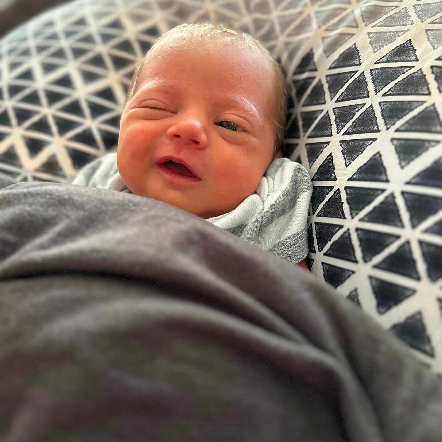 Ryatt is registered to the contest to win money with this photo: architecture, baby, bed, bedroom, blanket, cushion, face, furniture, happy, head, homedecor, indoors, newborn, person, photography, portrait, quilt, room, sleeping, smile