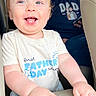 Kai joined the competition — help win amazing prizes! baby, child, smiling, happy, man, beard, tshirt, text, car, seat, armrest, candid, family, indoor, person, casual, blue, white, portrait, infant