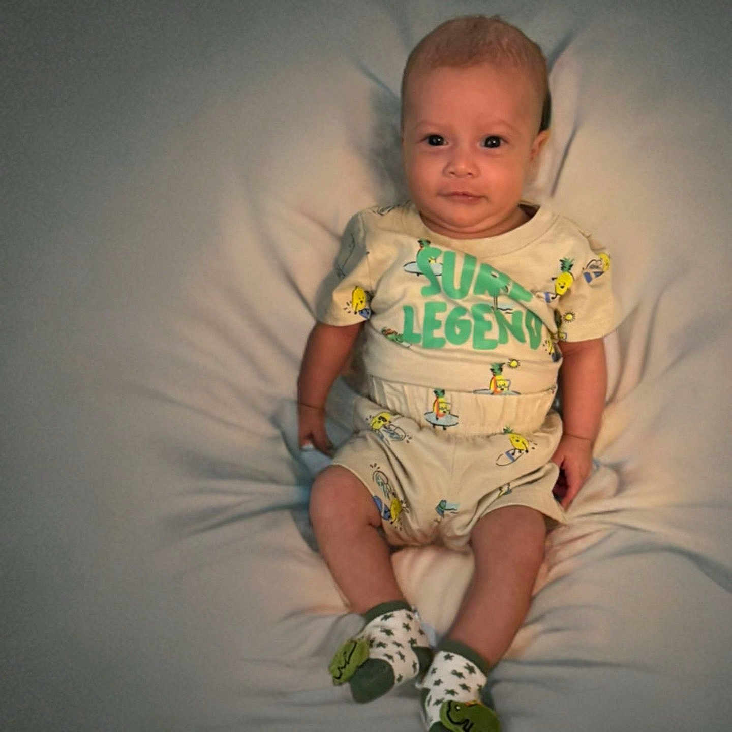 Thiago joined the competition — help win amazing prizes! baby, casual, child, clothing, colorful, comfort, cute, expression, face, head, indoor, infant, looking, person, portrait, print, sitting, socks, soft_surface, young