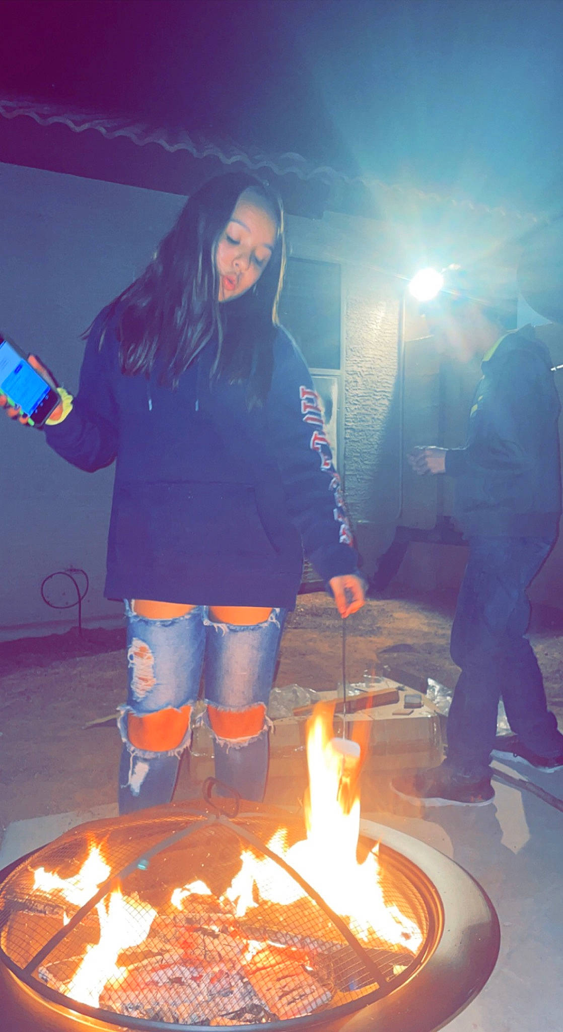 Savannah is registered to the contest to win money with this photo: bonfire, campfire, cooking, electric_blue, event, fire, fireplace, flame, flash_photography, fun, gas, happy, heat, human, lens_flare, light, people, person, photograph, snapshot