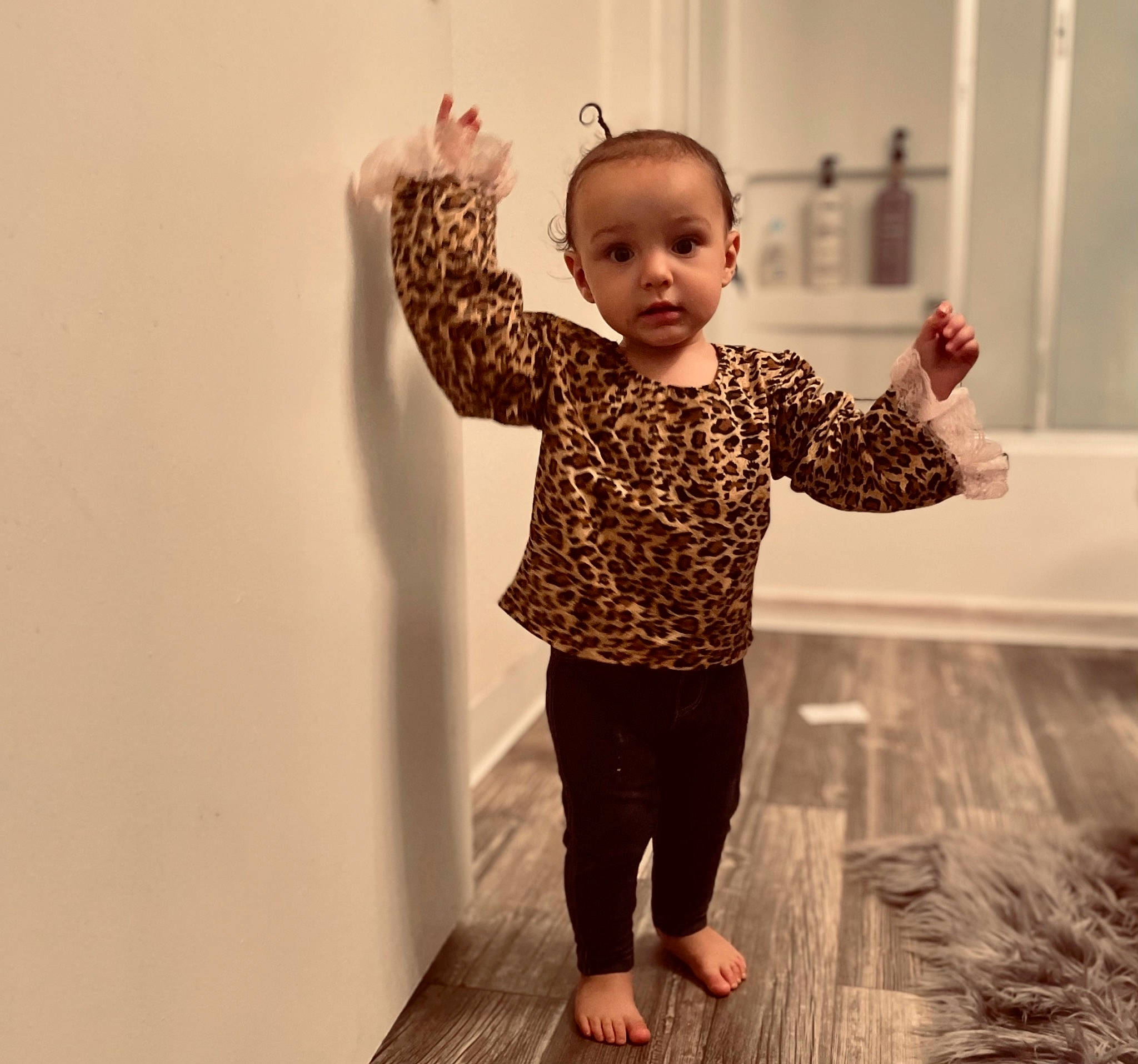 Rylinn is registered to the contest to win money with this photo: arm, baby_toddler_clothing, elbow, finger, flooring, gesture, happy, head, human_body, joint, leg, pattern, person, plant, shoulder, sleeve, smile, standing, thumb, toddler