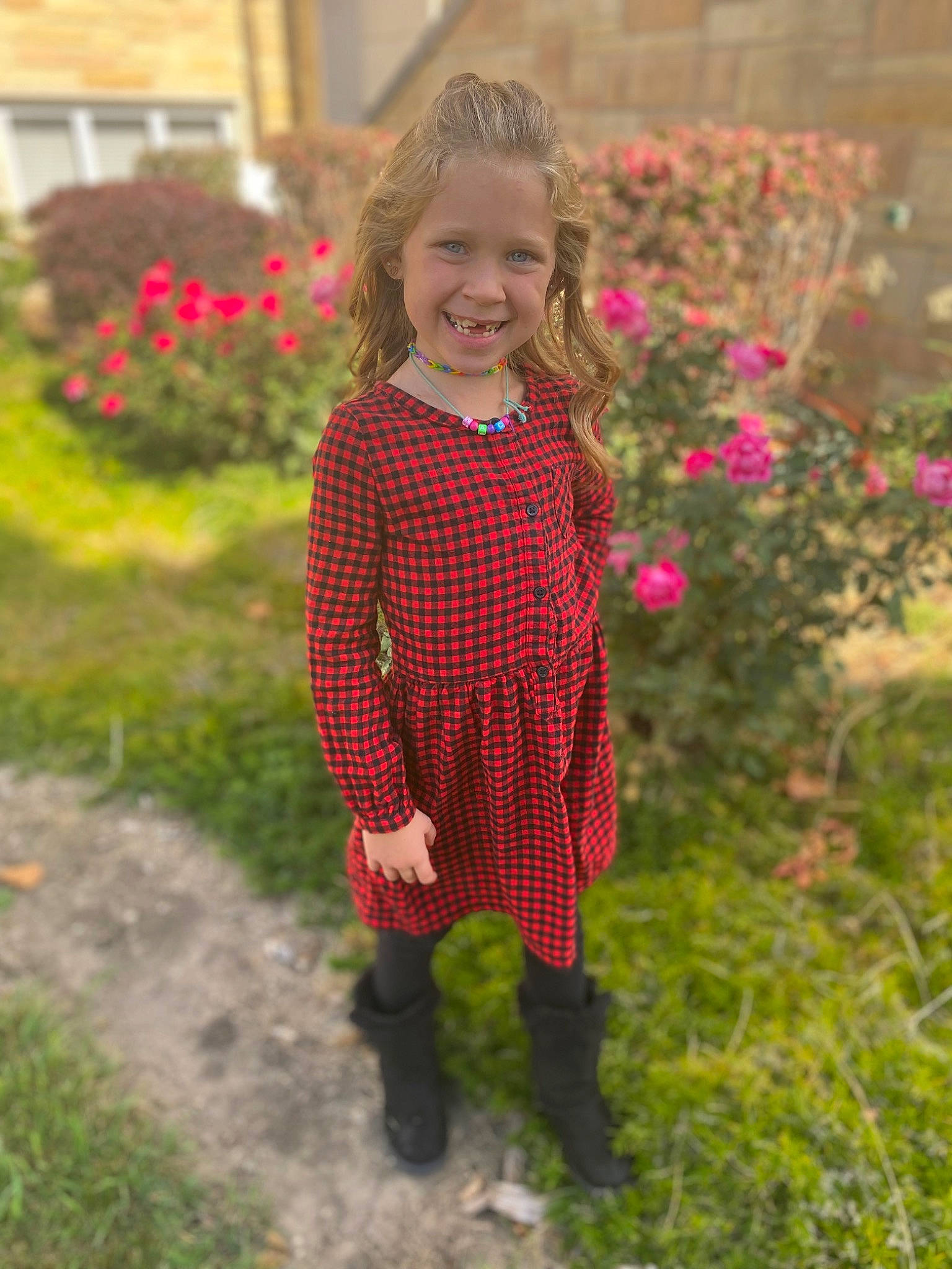 Maci is registered to the contest to win money with this photo: dress, eye, face, flower, footwear, grass, hair, happy, head, jeans, joy, meadow, outerwear, people_in_nature, person, plaid, plant, pumpkin, smile, tartan