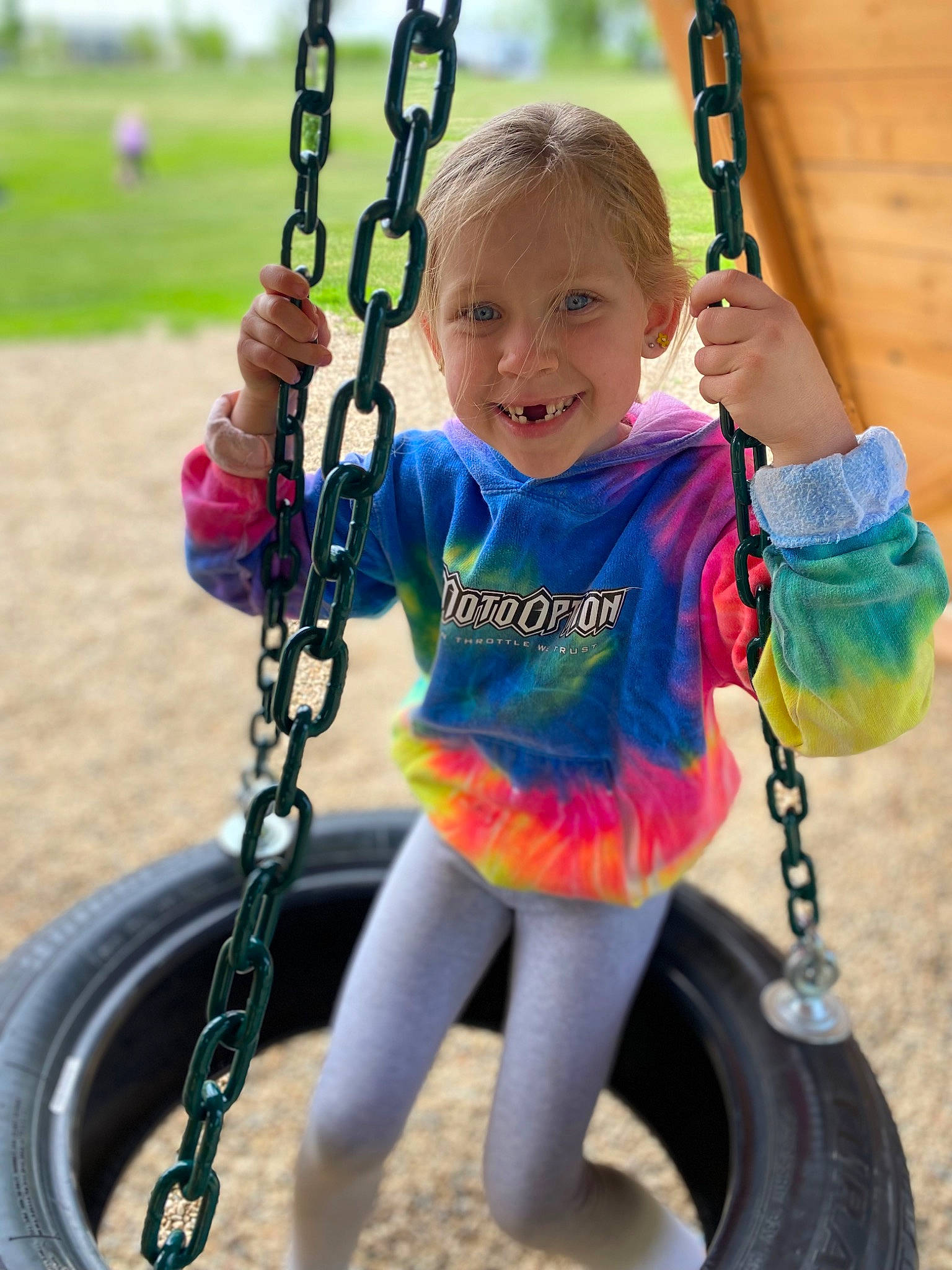 Maci joined the competition — help win amazing prizes! arm, automotive_tire, black, blue, child, fun, green, hand, happy, joy, leisure, person, photograph, playground, recreation, smile, snapshot, swing, tire, toddler