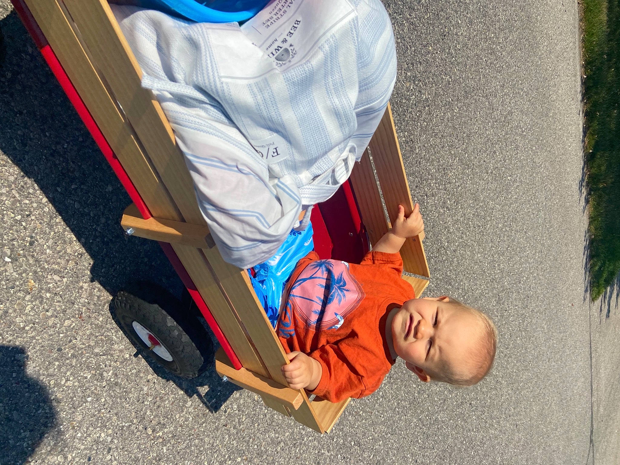 Gerald is registered to the contest to win money with this photo: asphalt, auto_part, baby_carriage, baby_products, chair, child, comfort, electric_blue, fun, human_leg, leisure, person, recreation, road_surface, sidewalk, sitting, sorrow, tire, toddler, travel