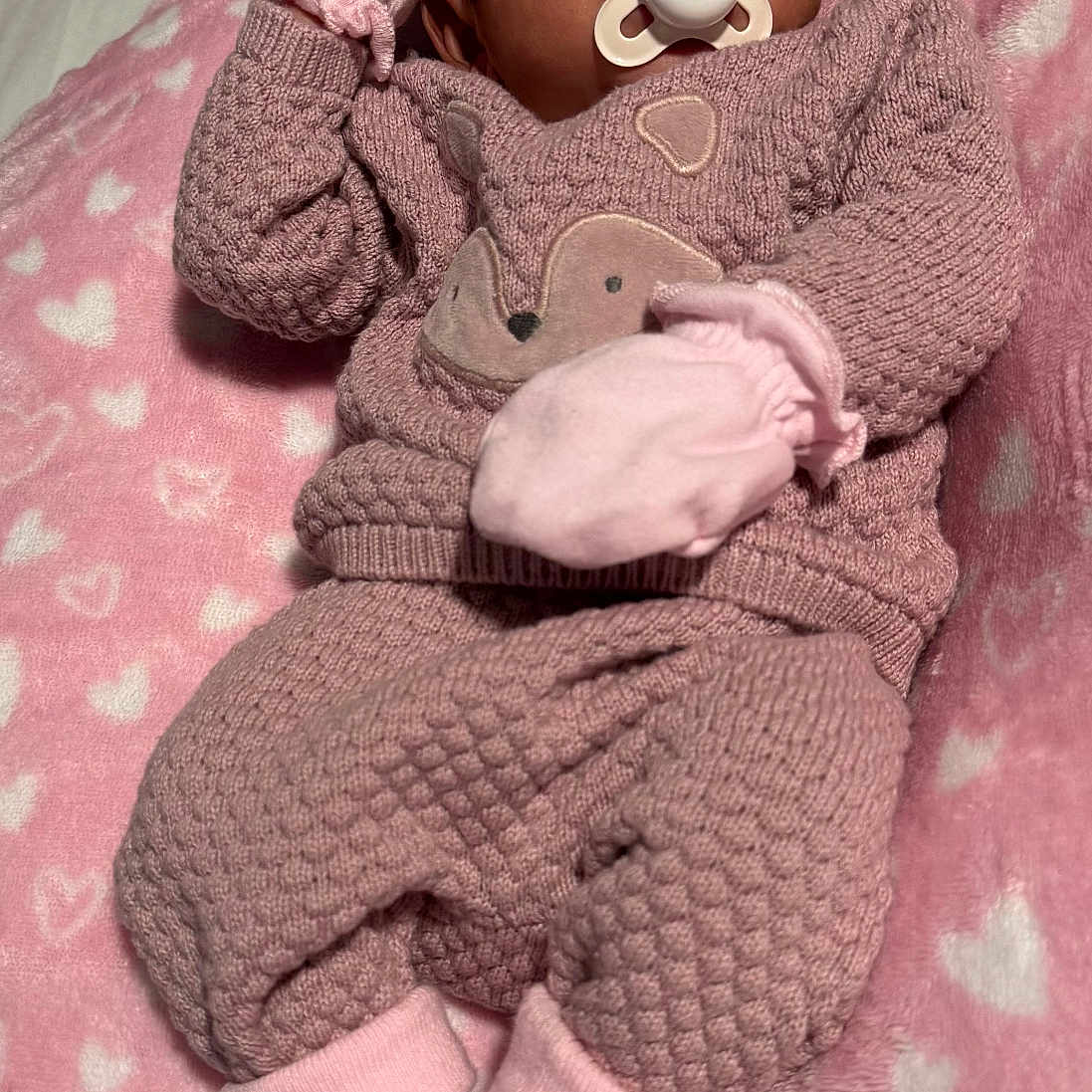 Saira joined the competition — help win amazing prizes! baby, blanket, clothing, cozy, cute, flower, headband, heart_pattern, infant, lying_down, mittens, newborn, pacifier, peaceful, pink, portrait, sleeping, socks, soft, textured