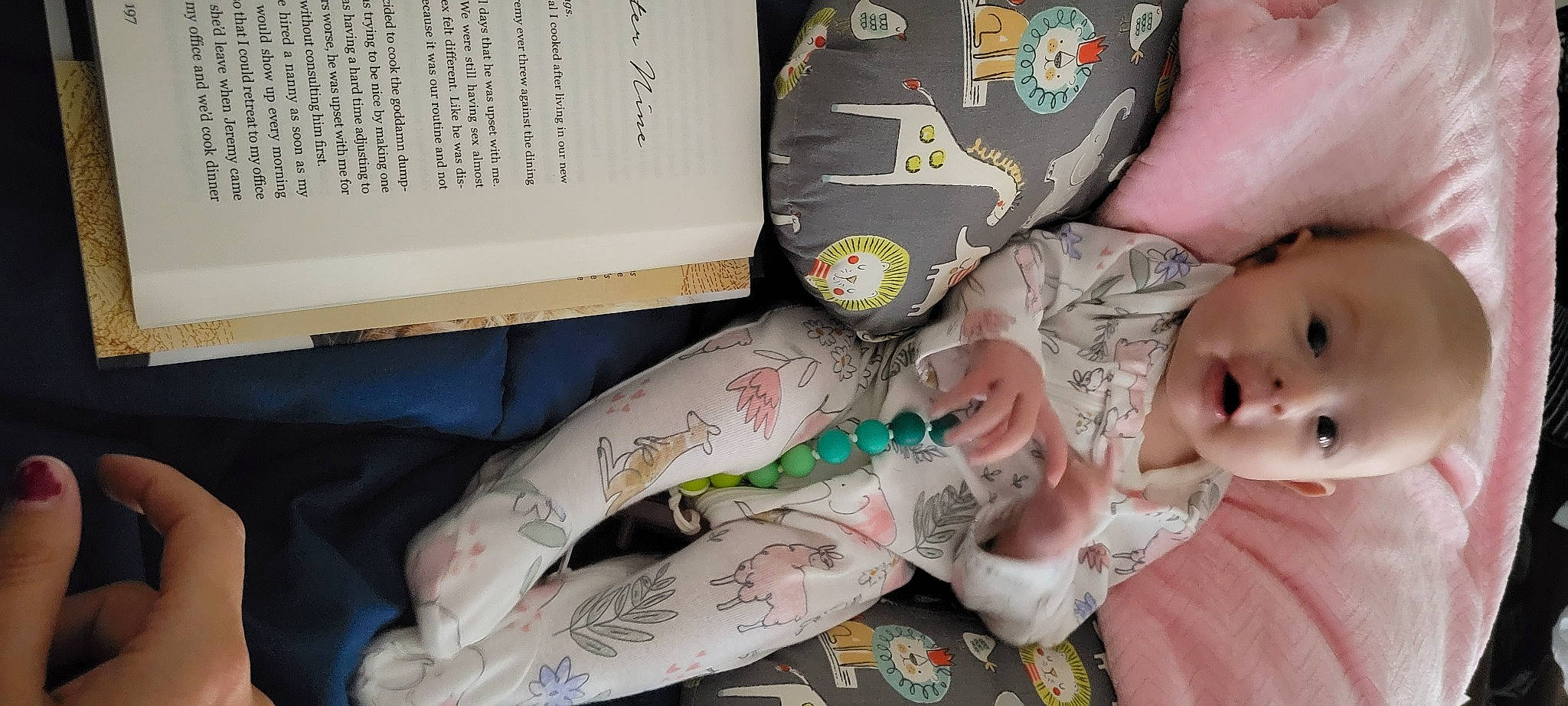 Calliope is registered to the contest to win money with this photo: art, baby, baby_toddler_clothing, book, comfort, elbow, flesh, font, human_body, human_leg, linens, nail, pattern, person, room, sleeve, tattoo, thumb, toddler, visual_arts