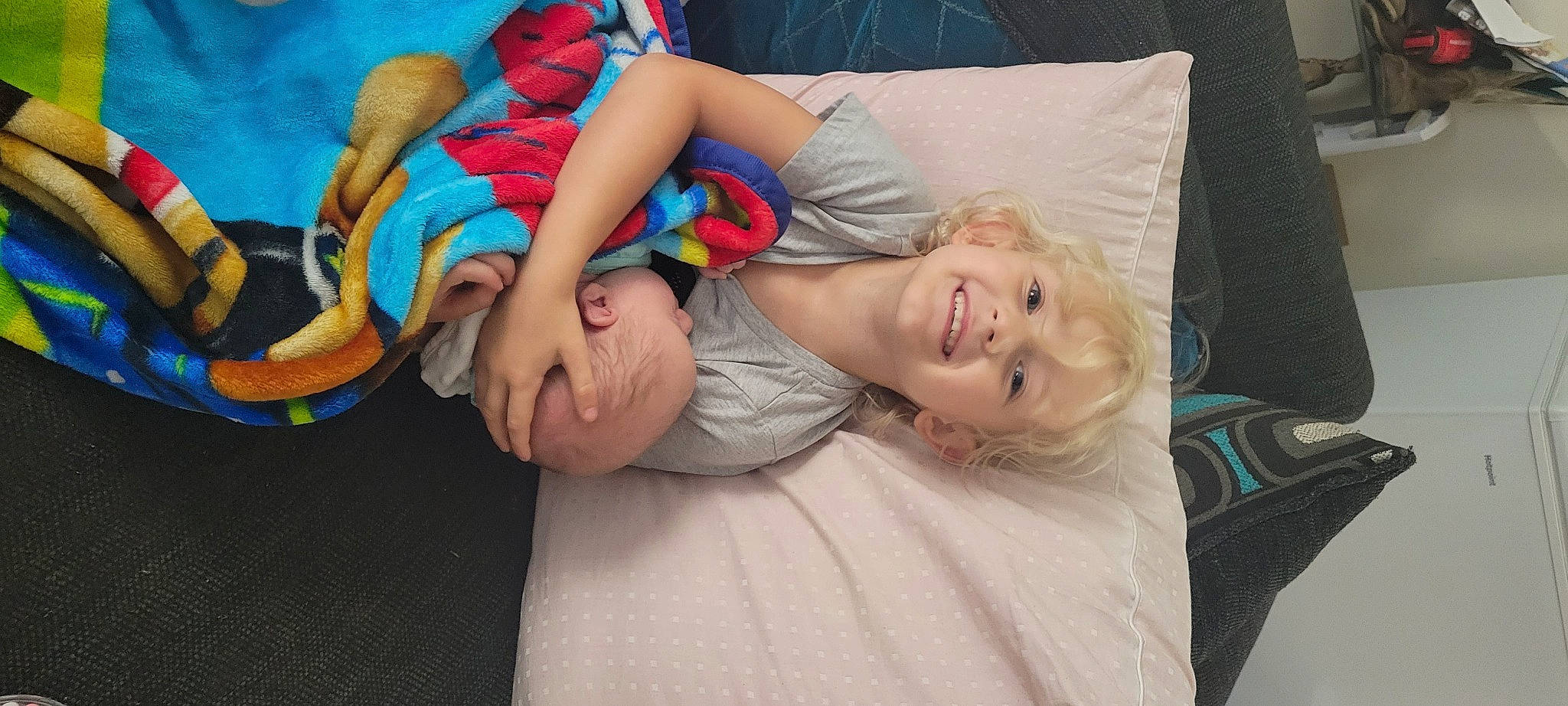 Xander is registered to the contest to win money with this photo: abdomen, baby, barefoot, child, comfort, foot, fun, happy, human_leg, joy, knee, lap, leisure, linens, nap, person, room, sitting, smile, textile