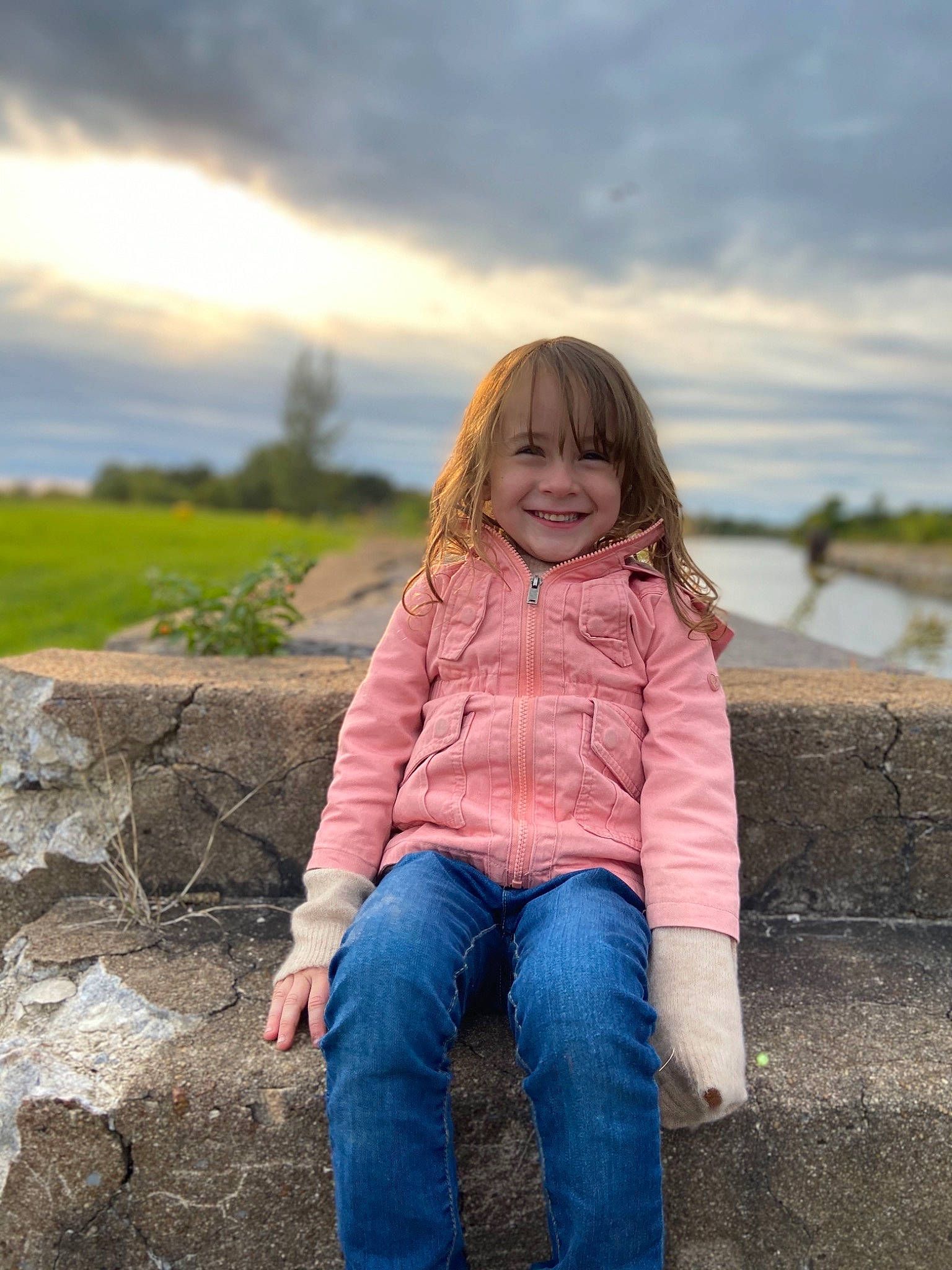 Emylee joined the competition — help win amazing prizes! child, cloud, grass, happy, joy, people_in_nature, person, photograph, photography, pink, sea, sitting, sky, smile, standing, summer, toddler, tree, vacation