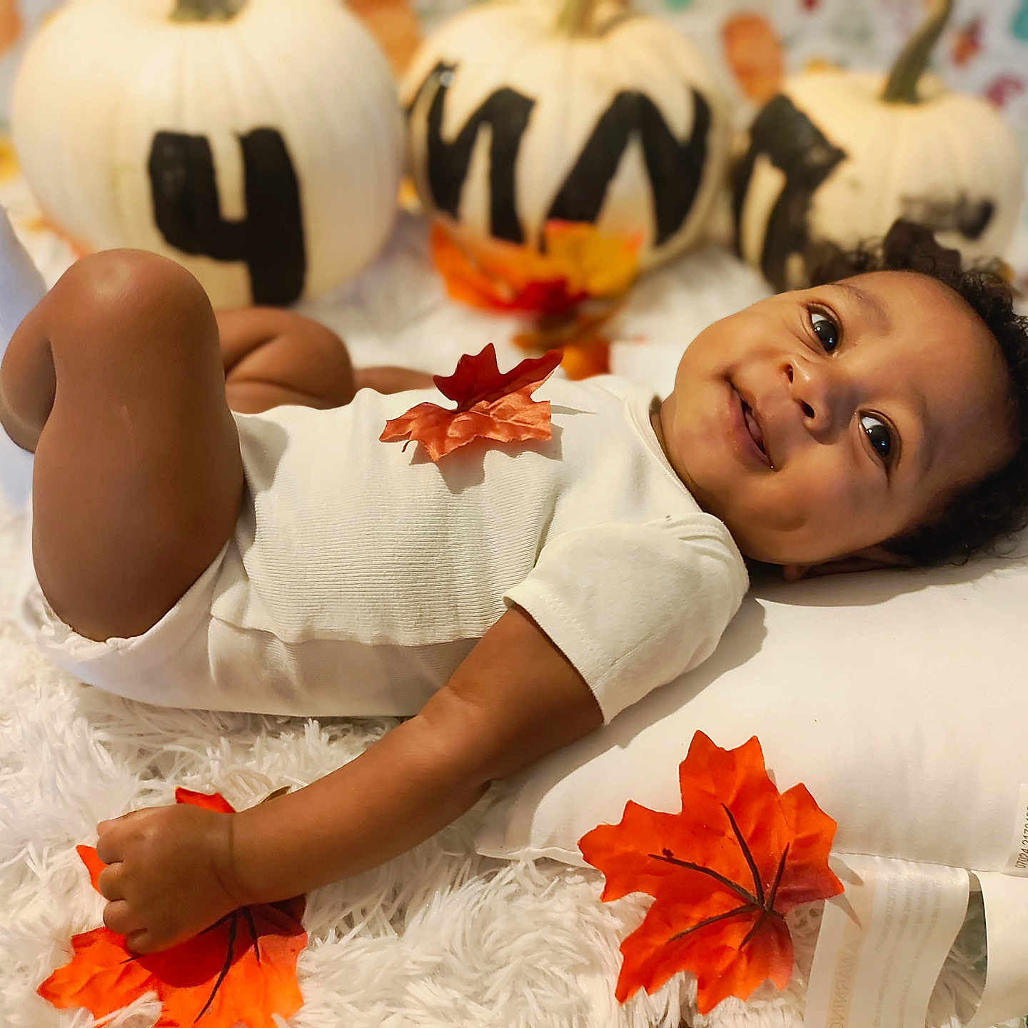 Austin is registered to the contest to win money with this photo: baby, babylaughing, bodypart, face, festival, finger, food, halloween, hand, happy, head, leaf, person, photography, plant, portrait, produce, pumpkin, smile, vegetable