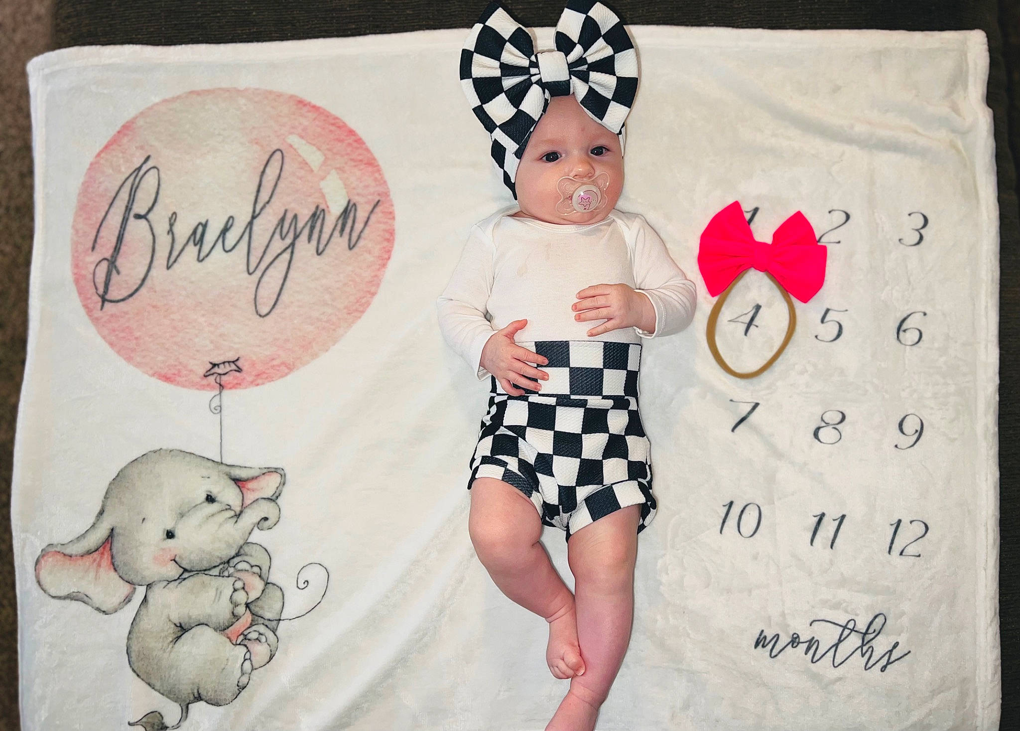 Braelynn joined the competition — help win amazing prizes! art, baby, baby_toddler_clothing, design, dress, fashion_accessory, fawn, font, happy, headwear, linens, mammal, pattern, person, pink, product, sleeve, t_shirt, textile, toddler