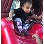 toddler, child, playground, slide, curly_hair, black_shirt, floral_leggings, outdoor, play, toy, red, plastic, little_tikes, fun, adventure, person, feet, hand, daylight, activity