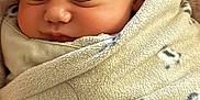 Avalon joined the competition — help win amazing prizes! baby, blanket, cheek, closed_eyes, closeup, cozy, ear, face, fleece, infant, newborn, nose, nursery_bedding, peaceful, portrait, rest, sleeping, soft_texture, swaddle, wrapped