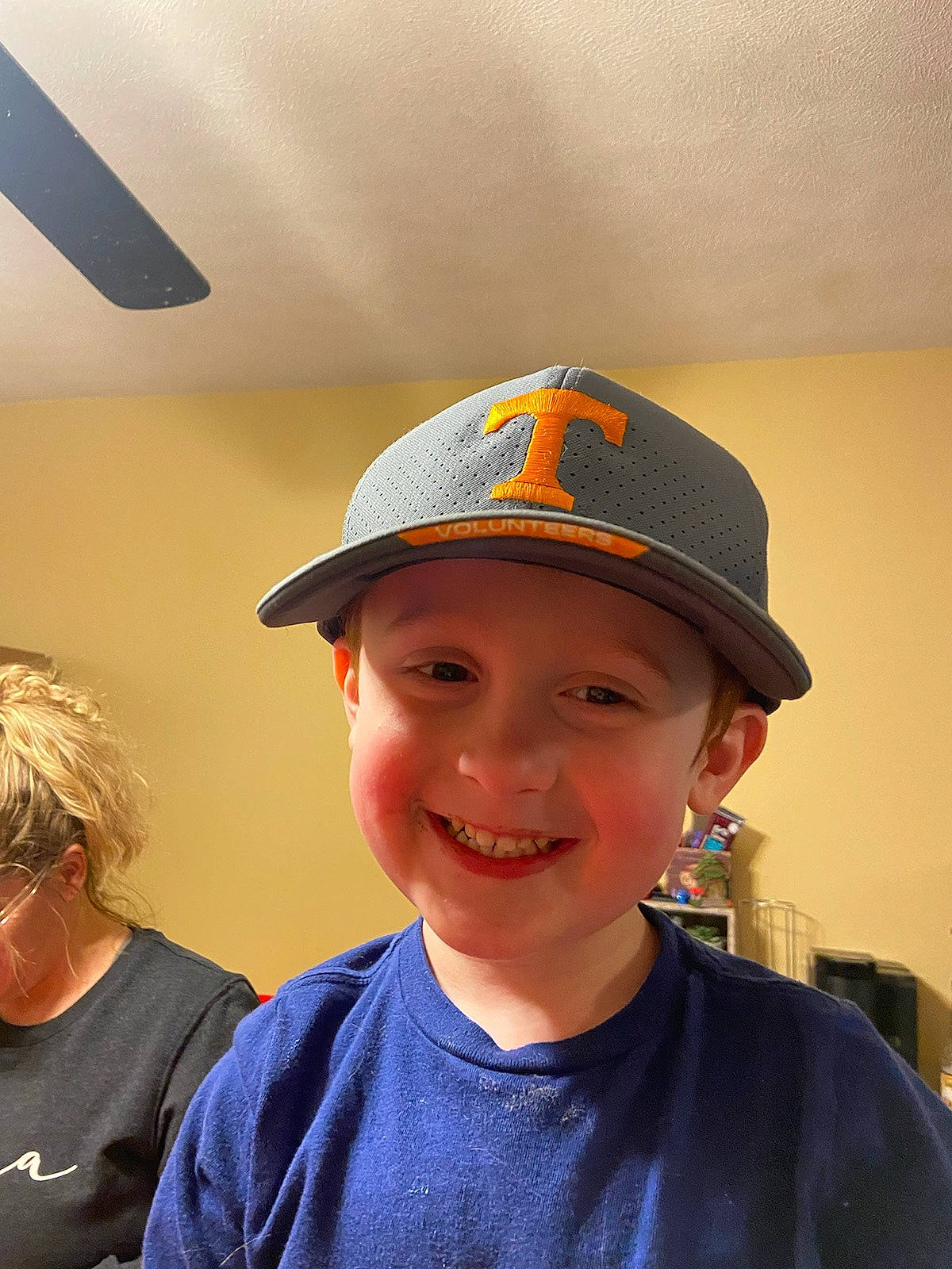 Zane is registered to the contest to win money with this photo: baseball_cap, cap, child, cricket_cap, electric_blue, eyewear, fashion_accessory, forehead, fun, gesture, happy, hat, headgear, headwear, joy, neck, person, personal_protective_equipment, room, smile