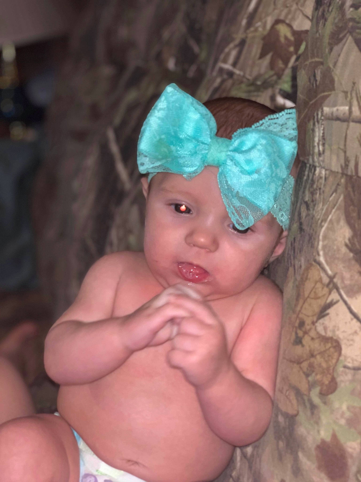 Kenzlee is registered to the contest to win money with this photo: baby, child, eye, fashion_accessory, finger, hair_accessory, hand, headgear, muscle, person, skin, toddler