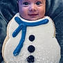 baby, background, blanket, blue_icing, child, closeup, cookie, cute, decorated, face, food, frosting, holiday, icing, portrait, smile, snowman, sweet, toddler, winter