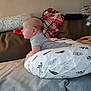 Sawyer joined the competition — help win amazing prizes! baby, infant, pillow, feather_pattern, blanket, couch, hand, side_view, curious, indoor, soft_lighting, person, clothing, head, face, resting, comfort, home, young_child, support