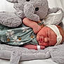 Sawyer joined the competition — help win amazing prizes! newborn, baby, sleeping, plush_elephant, soft_toy, headband, floral_outfit, cozy, cute, infant, resting, child, toddler, soft_texture, cuddly, peaceful, pink_skin, fabric, toy, sleep