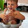 Meyson a rejoint le concours — aidez-le/la à gagner de superbes lots ! child, baby_bottle, smiling, indoor, blue_eyes, blond_hair, plastic_container, happy, toddler, skin, floor_tiles, furniture, hand, mouth, tooth, person, casual, sitting, home, playful
