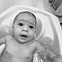 baby, child, infant, bathtub, bath, water, splash, face, eyes, mouth, skin, arm, head, curious, cute, black_and_white, indoor, bath_time, young, person