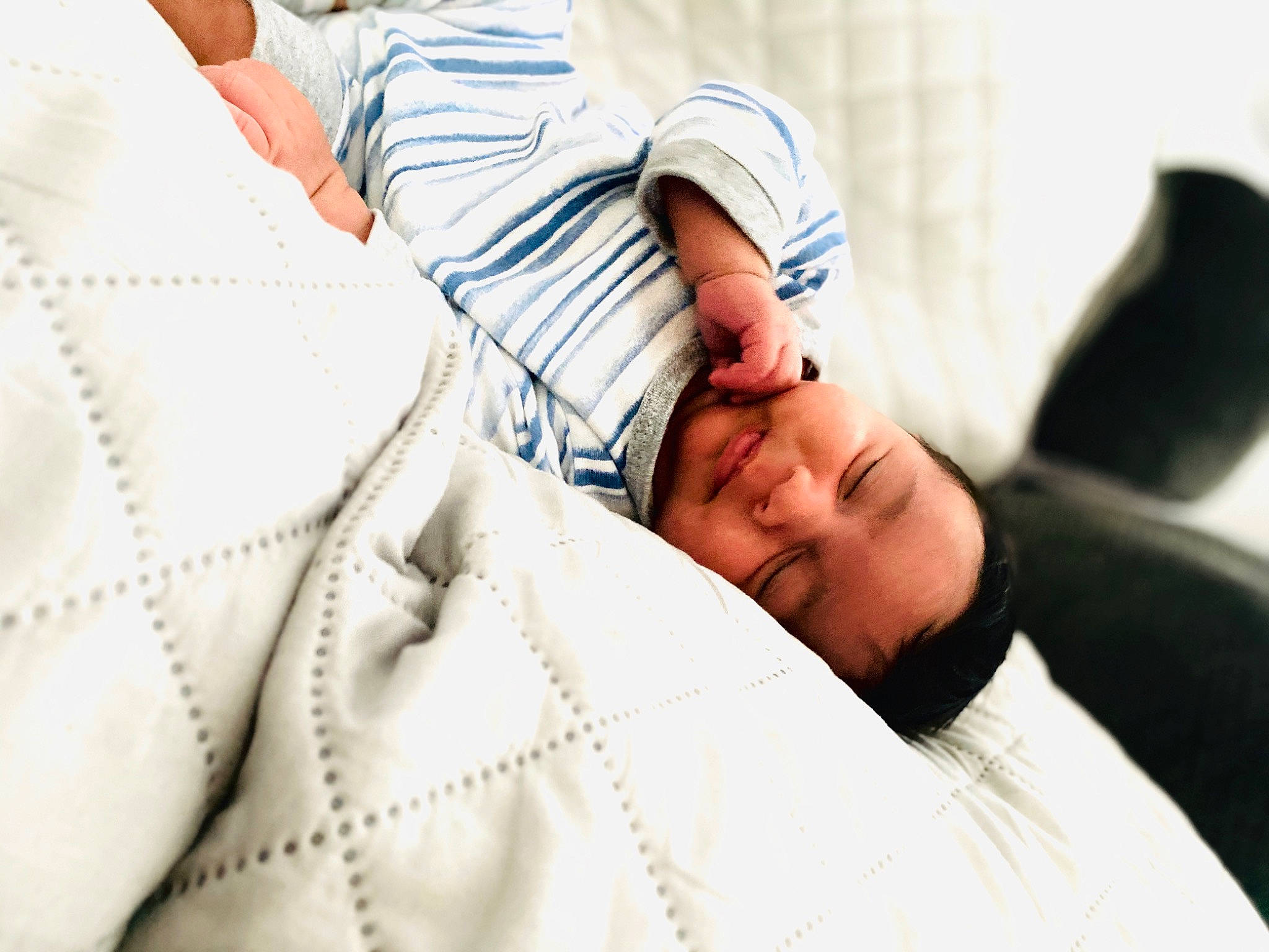 Noah is registered to the contest to win money with this photo: arm, baby, birth, child, comfort, ear, furniture, gesture, hand, happy, joint, leisure, nap, neck, nose, person, photography, skin, sleep