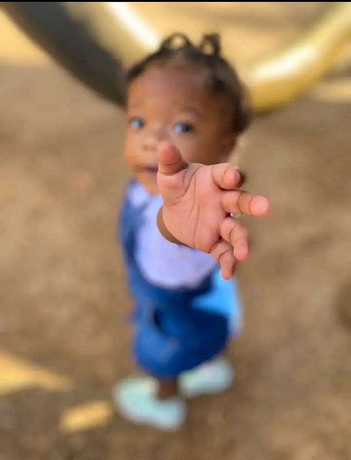 Kabella is registered to the contest to win money with this photo: baby, baby_toddler_clothing, cheek, child, electric_blue, flooring, fun, gesture, grass, happy, head, nose, person, sitting, sleeve, smile, soil, swing, thumb, toddler