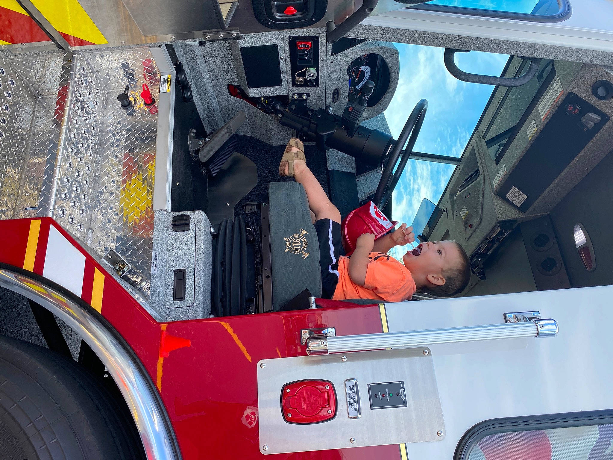 Callen is registered to the contest to win money with this photo: auto_part, automotive_design, automotive_exterior, automotive_tire, automotive_wheel_system, bumper, commercial_vehicle, gas, hood, light, mode_of_transport, motor_vehicle, person, red, service, tire, vehicle, vehicle_door, wheel, white