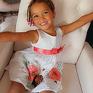 Paislee joined the competition — help win amazing prizes! child, smiling, dress, floral_dress, armchair, arms, beads, hair_bow, happy, portrait, indoor, living_room, upholstery, toddler, legs, playful, cute, seat, person, white_dress